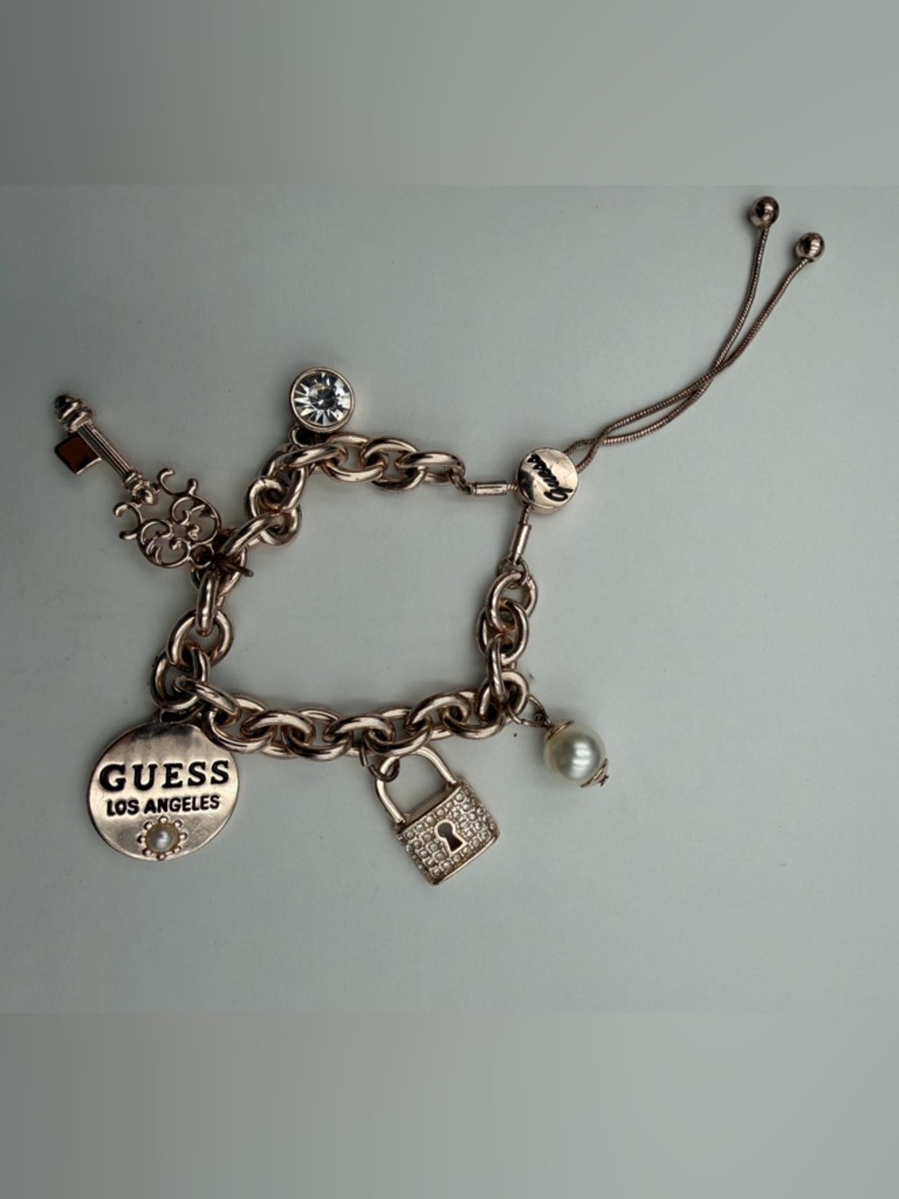 GUESS Rose Gold-Tone Charm Bracelet with Crystal, Pearl & Padlock